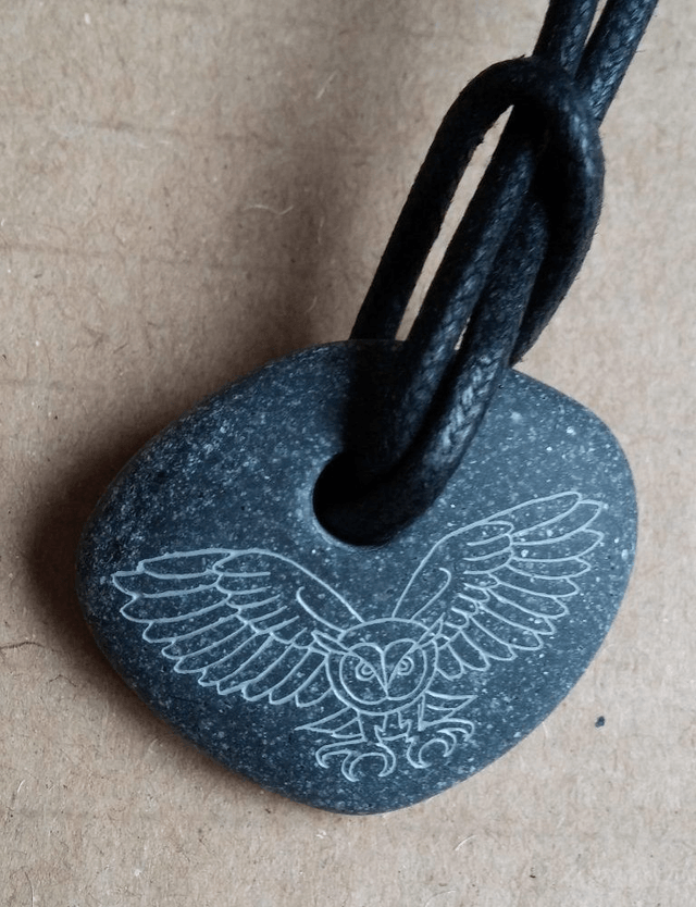 Pebble pendant  - Long-eared owl in flight